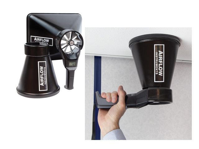 Qualified engineer carrying out extract fan test